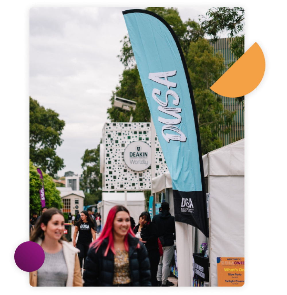 Two students walking along Morgans Walk at Burwood during a DUSA Event