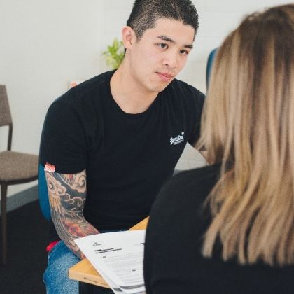 Student discussing his options with Advocacy staff member