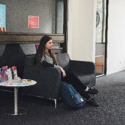 Female sitting on a couch in a waiting room